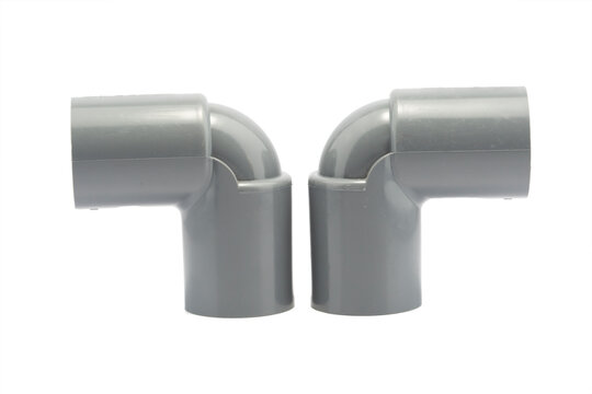 Close-up photo of plastic paralon pipe connections on a white background
