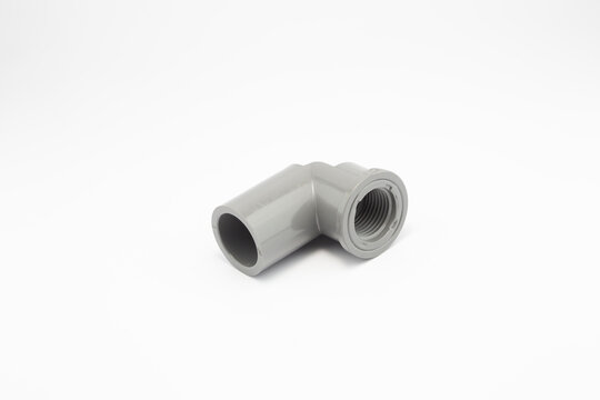 Close-up photo of plastic paralon pipe connections on a white background