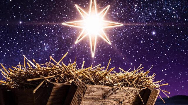 Bright shining star above empty wooden manger with hay on starry night sky background