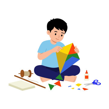 Child Making Colorful Paper Kite With Scissors And Glue