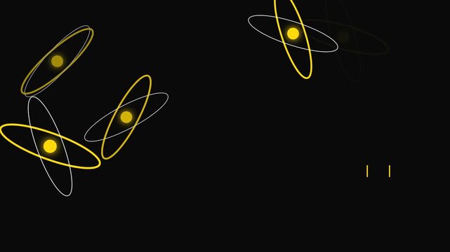 Glowing atomic particle animation featuring rotating yellow orbital energy rings floating in dark empty space for physics education motion footage