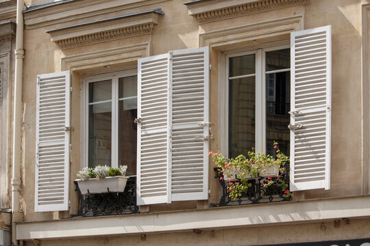 Windows Exterior Facade With Shutters And Plants In Paris