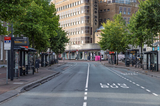 Haarlem, Netherlands - 16 August 2026: Close view of R-NET bus stop shelter and empty asphalt bus lane in downtown Haarlem.