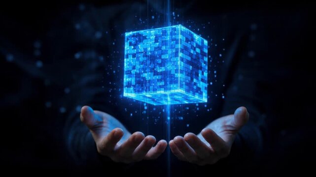 Futuristic digital cube floating above human hands glowing with blue technology light