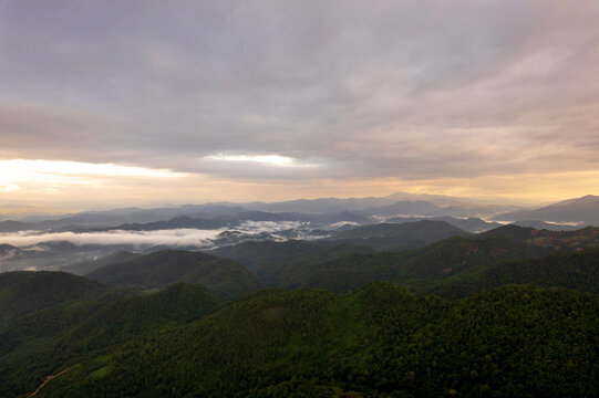 Landscape of Morning Mist with Mountain Layer. mountain ridge and clouds in rural jungle bush forest