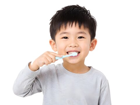 Cute boy brushing teeth on white background isolated