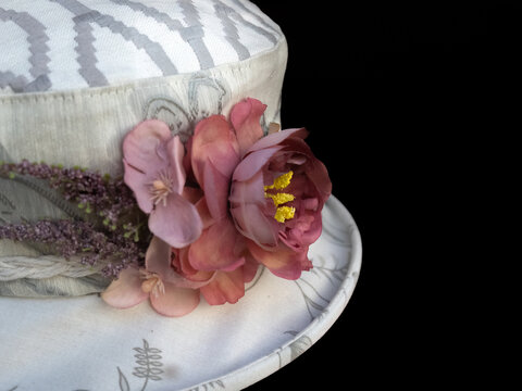 Dried flower decoration on white hat