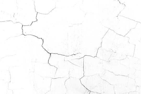 ​White cracked wall texture background with black crack lines