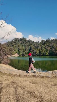 Hiker walking near Deoria Tal lake in Chopta Uttarakhand near Tungnath temple landmark