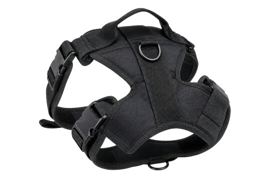Durable black tactical dog harness with a top handle and metal D-rings is presented on a clean white background