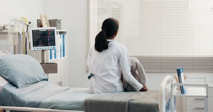 Back, healthcare and thinking with girl on hospital bed for post surgery contemplation or recovery. Medical care, reflection and teddy bear of child patient in clinic for treatment or wellness
