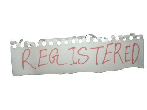 Registered word written in red ink on a small torn piece of white paper note isolated on transparent background