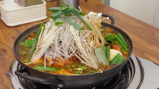 Korean Pork Spine Potato Soup Gamjatang Boiling on Stove Just Served