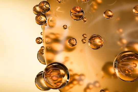 Abstract 3D yellow oily sphere drops close-up. The concept of hair, face and body care. Moisturizing and rejuvenating the skin. Background for the beauty industry.