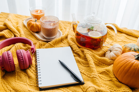 Autumn cozy lifestyle with hot tea and journal