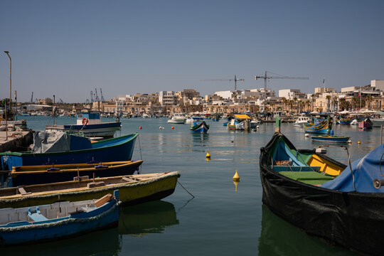 Colorful traditional fishing boats in Marsaxlokk harbor