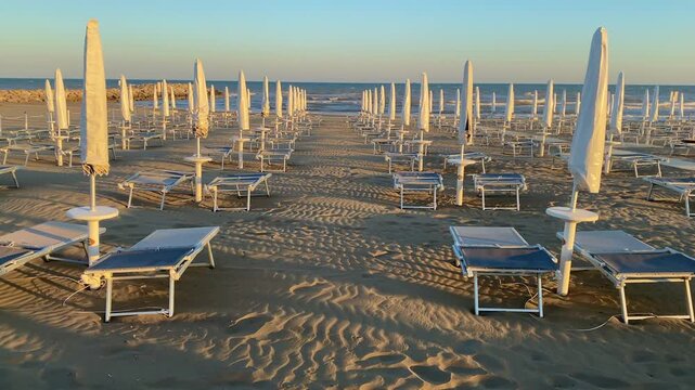End of season. In the evening among empty deckchairs and parasols