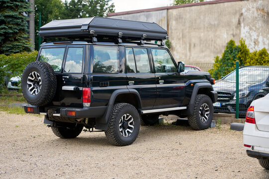 Outdoor travel SUV with camping equipment setup