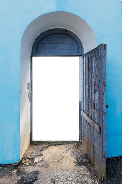 Blue archway frames weathered wooden door