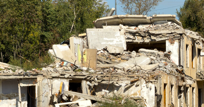 Ruined building with broken walls and scattered debris