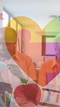 Animation of colourful puzzle pieces heart over senior friends using electronic devices