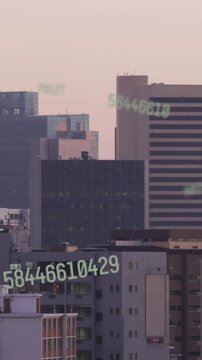 Animation of changing numbers over aerial view of modern city in background