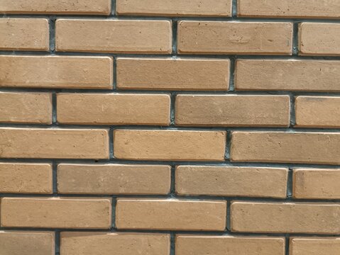 Orange brick wall with cement to joint each other