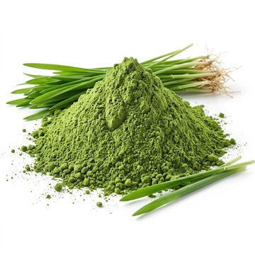 A pile of vibrant green powder next to fresh green grass with roots on a white background.