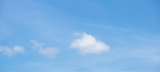 Fototapeta premium Beautiful blue sky with white clouds on a sunny day background