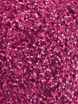 Bright pink sequin fabric texture background