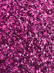 Obraz premium Bright magenta sequin fabric background texture