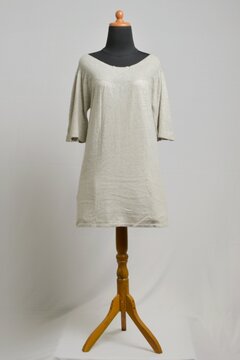 Light gray sweater dress with boat or Sabrina neckline on a dress form