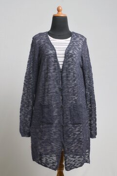Sheer navy long cardigan with soft pink striped sweater dress on a dress form