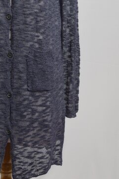Sheer navy long cardigan with soft pink striped sweater dress on a dress form