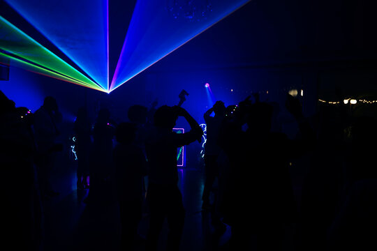 Unrecognizable people dancing in a nightclub