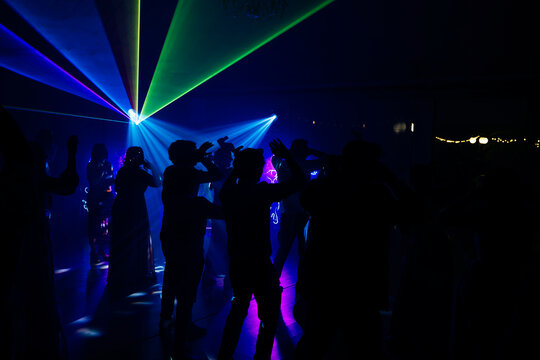 Unrecognizable people dancing in a nightclub