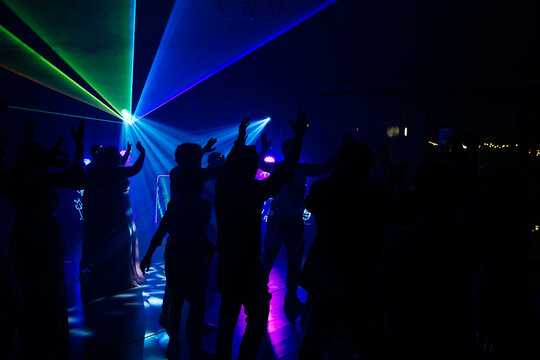 Unrecognizable people dancing in a nightclub