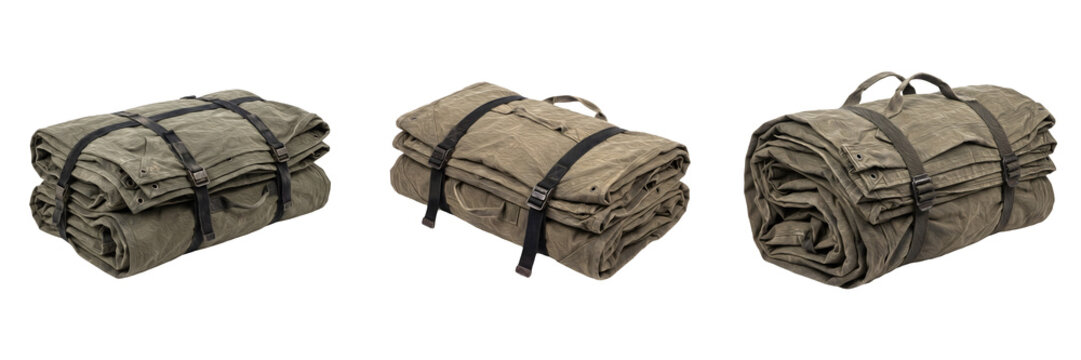 Rolled canvas bedrolls with black utility straps camping blanket rolls tactical bed roll military style outdoor sleeping gear isolated on white background stock photo