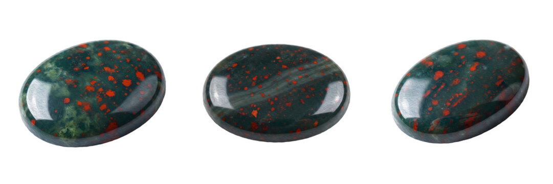 Polished bloodstone cabochons dark green chalcedony with red spots tumbled gemstone crystal healing stones oval mineral specimens isolated on white background stock photo