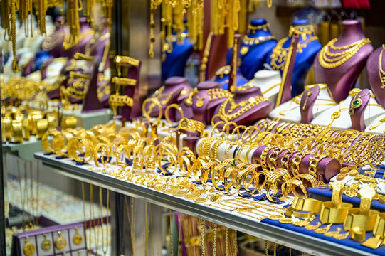 Ornate Turkish gold jewelry, gold bangles and necklaces in a jeweler's display case at the bazaar, Trabzon, Black Sea region, Trabzon Province, T&uuml;rkiye.