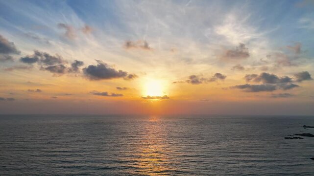 serene sunrise ocean landscape with rising sun, gold light and peaceful beach horizon creating tropical paradise background for meditation