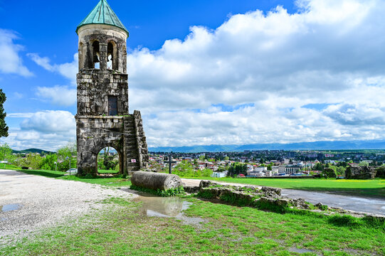 Medieval Bagrati Cathedral with a green domed roof and bell tower on Ukimerioni Hill above the city of Kutaisi, Imereti region, Georgia