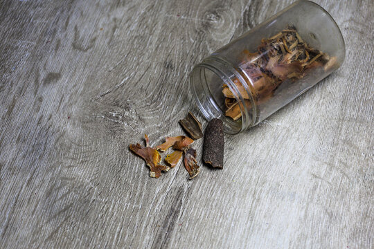 Cinnamon and Mace Spice Mix Spilled from Glass Jar on Wooden Surface &mdash; Aromatic Still Life