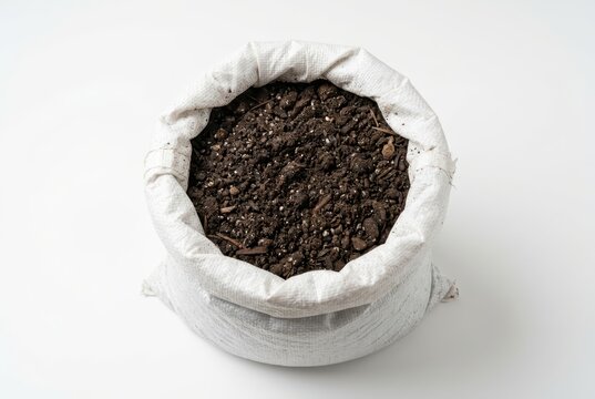 Rich Dark Organic Potting Soil and Compost in a White Woven Sack Isolated on White Background