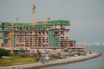 Landscape View of Construction Site of a Building Near Shoreline of The Sea. © DegreeStudioMY