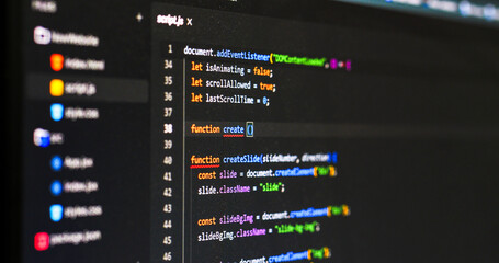 Close-up detail of web software script code typing on screen © MEDIAIMAG