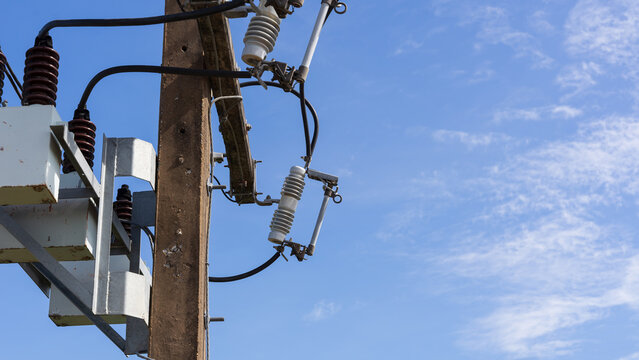 Capacitor bank and high voltage cutout fuses on utility pole