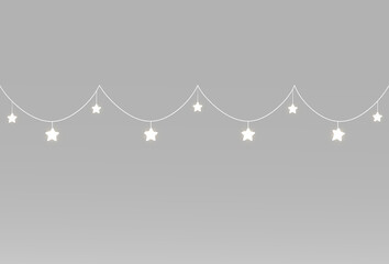 Festive star garlands with delicate white light suspended on two gently curved hanging strings above