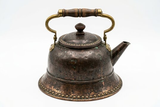 Antique Copper Tea Kettle with Wooden Handle and Decorative Rivets Isolated on White Background