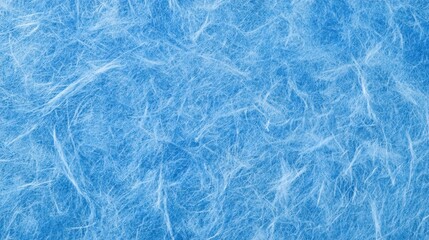 Obraz premium This blue recycled paper texture shows visible fibers on a soft surface. It serves as a backdrop with space for text and design in craft projects.